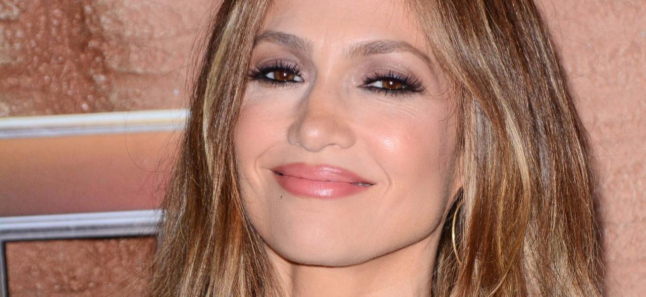Jennifer Lopez Impresses Herself In Plunging Poolside Swimsuit