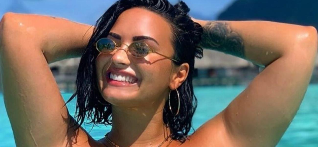 Demi Lovato shines in her birthday swimsuit with a pickle jar