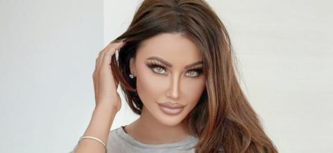 Holly Sonders Opens Her Shirt With Nothing Underneath