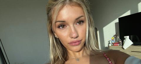 Breckie Hill Teases Ample Skin In Her Plunging Brown Swimsuit