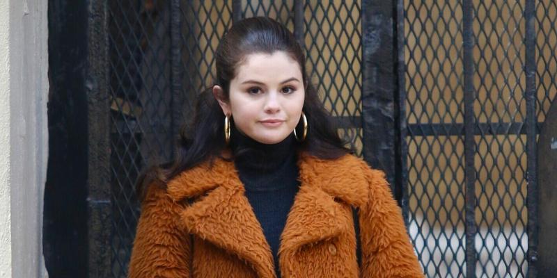 Selena Gomez is all smiles sporting a long brown orange furry coat while filming Only Murders In The Building in NYC