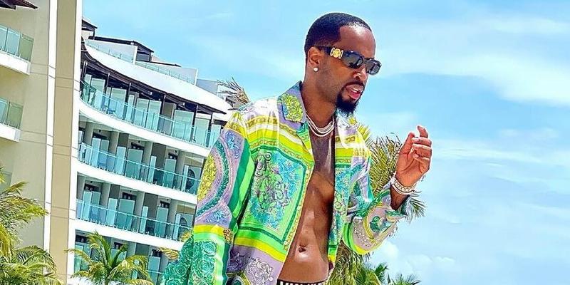 Safaree in a green Versace suit