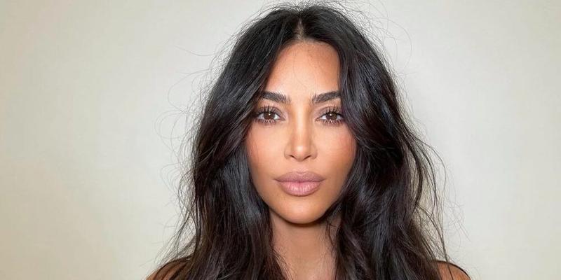 Kim Kardashian pursing her lips with messy hair