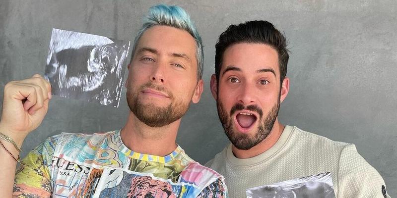 A photo showing Lance Bass and his husband, Michael Turchin, holding their kids' sonogram