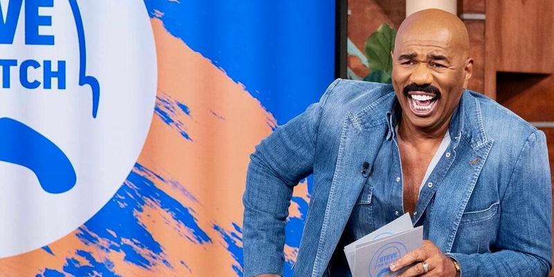 A photo showing Steve Harvey in a denim outfit.