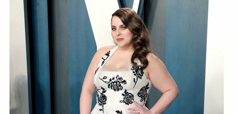 A photo of Beanie Feldstein in a flowered dress at the Vanity Fair event