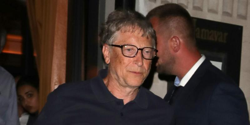 Microsoft Founder Bill Gates stumbles on a step as he leaves Jamavar in Mayfair after dining with friends