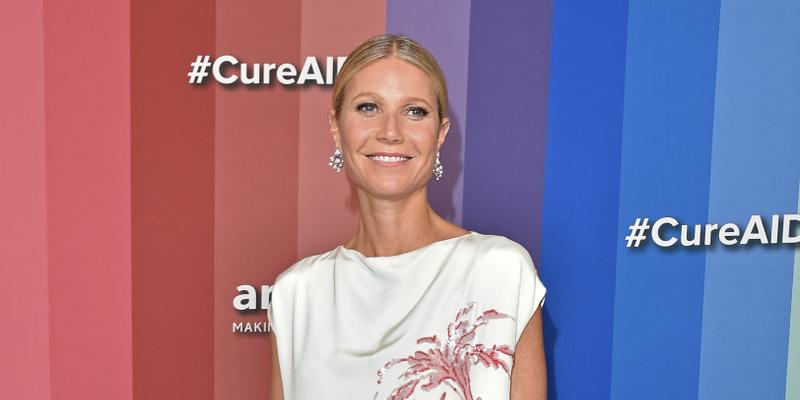A photo of Gwyneth Paltrow in a white long dress with flowery embroidery