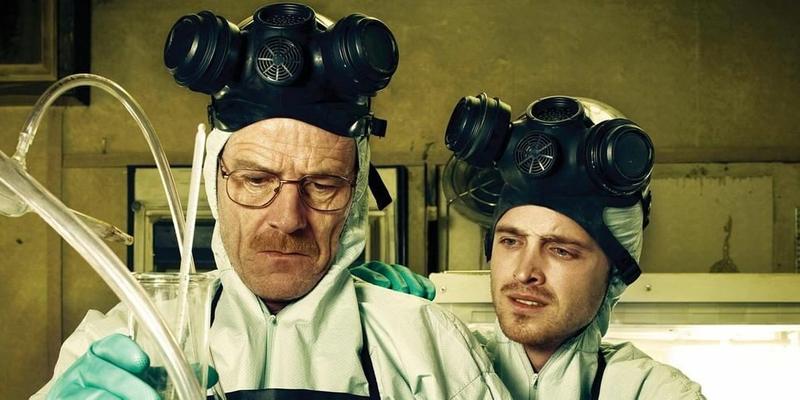 A photo showing the lead cast of 'Breaking Bad' cooking meth in a lab.