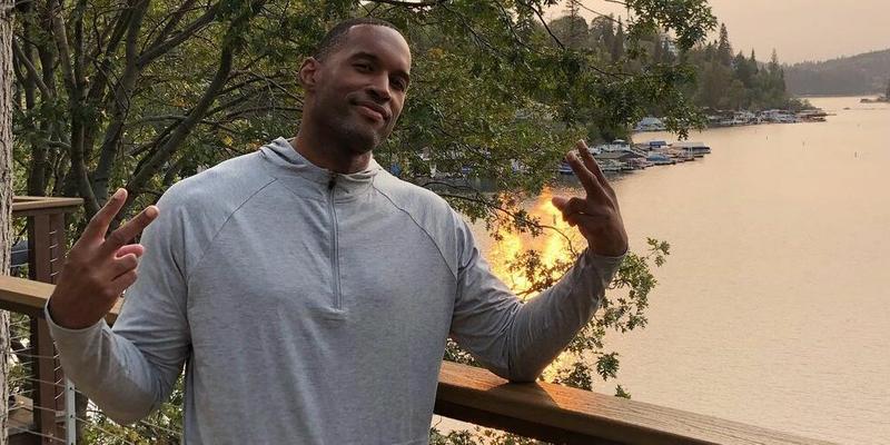 A photo showing Lawrence Saint-Victor in a gray sweatshirt, showing off the 'peace' sign.