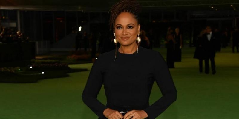 A photo showing Ava DuVernay in a black body-hug dress.