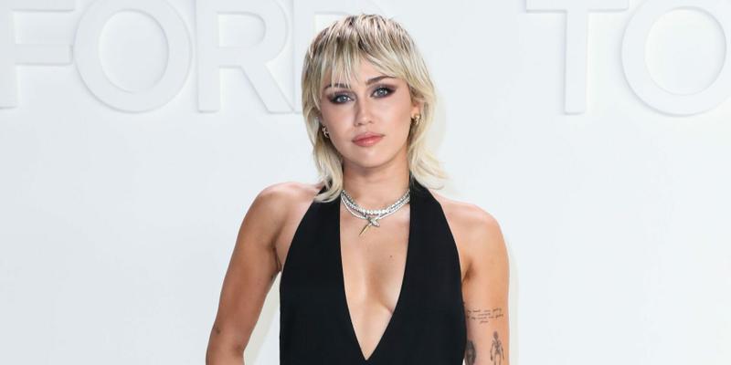 Miley Cyrus in attendance at the Tom Ford: Autumn/Winter 2020 Fashion Show sporting a black jumpsuit.