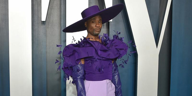 Billy Porter wearing massive purple hat