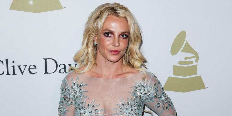 Britney Spears wearing a custom Uel Camilo dress, Loriblu shoes and bag, and a Jen Hansen ring arrives at The Recording Academy And Clive Davis' 2017 Pre-GRAMMY Gala