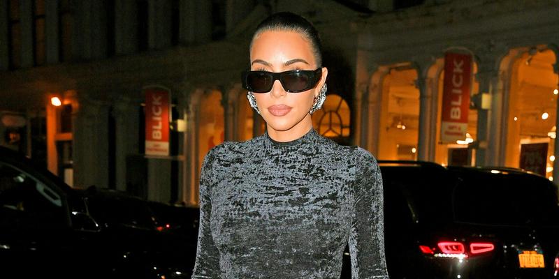 Kim Kardashian shows off her famous curves in a black dress
