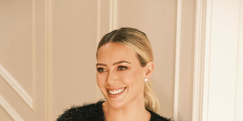 Hilary Duff shows off her shapely legs and dazzles in festive tinsel Smash Tess romper