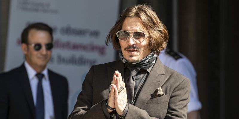 Actor Johnny Depp arrives at the High court in London as the legal action against The Sun newspaper continues.