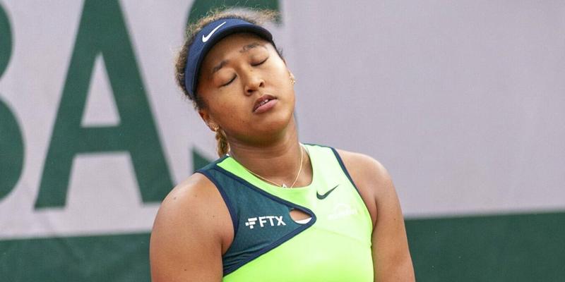 Naomi Osaka of Japan reacts after losing a point to Amanda Anisimova of the United States during their first-round match at the French Open tennis tournament in Paris on May 23, 2022.