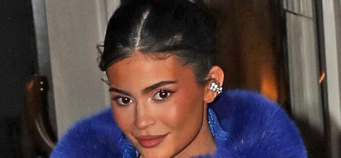 Kylie Jenner and daughter Stormi wow fans as they leave their hotel wearing an oversized blue crocodile skin and fur coat with a very leggy display