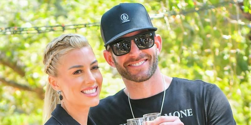 Heather Rae Young and Tarek El Moussa stroll through the Kindred Spirits Care Farm after celebrating her new Peta Campaign