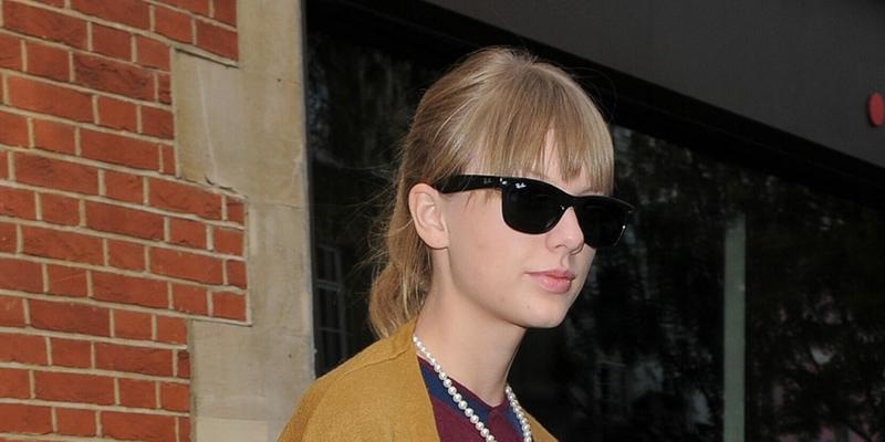 Taylor Swift leaving The Hospital Club in Covent Garden The singer was wearing polkadot jeans a maroon sweater with a yellow cardigan over the top She also wore sunglasses a pearl necklace and a burnt orange Mark Cross Scottie Satchel