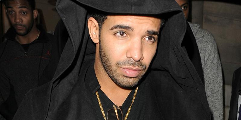Drake leaving Aura nightclub The Canadian rapper wore a black hoodie grey jeans purple Timberland boots and a gold chain
