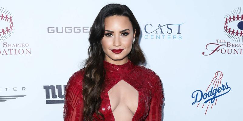 Demi Lovato at an event in a red dress