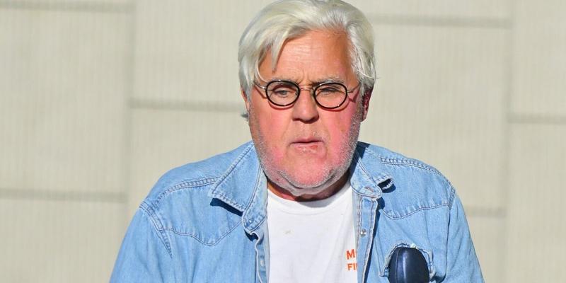 Jay Leno stops by a gas station in yet another cool car after getting out of the hospital yesterday