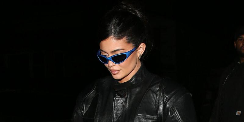 Kylie Jenner wears All Black Leather and blue sunglasses as she arrives for dinner at Giorgio Baldi Italian Restaurant in Santa Monica, CA
