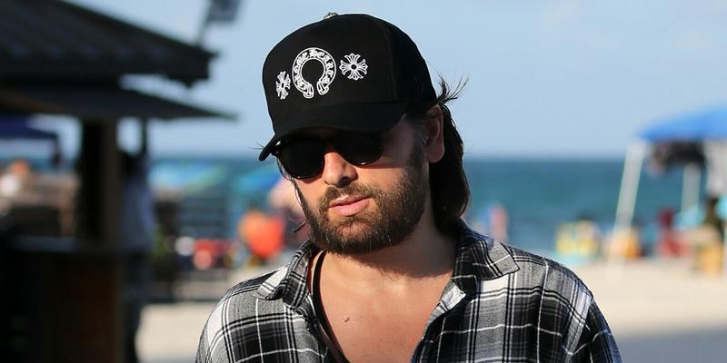 Scott Disick spends his Fourth of July holiday surrounded by bikini clad women on the beach in Miami