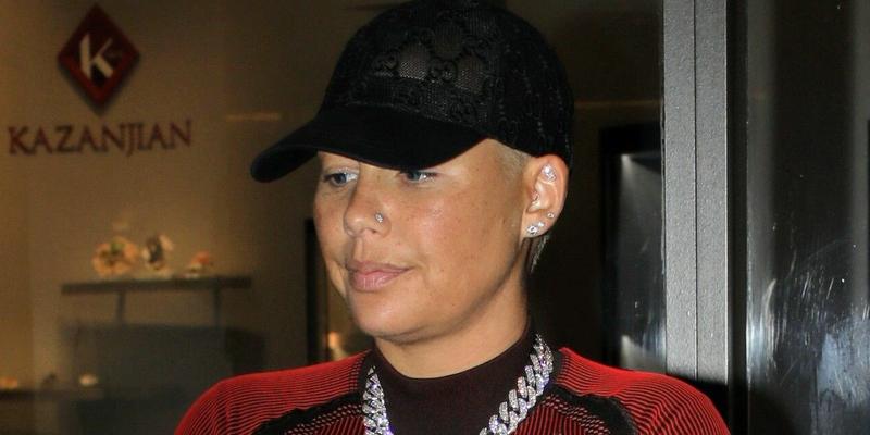 Amber Rose with baby daddy after he gets new forehead tattoo honoring specific dates