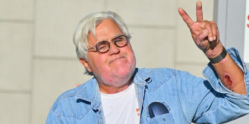 Jay Leno stops by a gas station in yet another cool car after getting out of the hospital yesterday