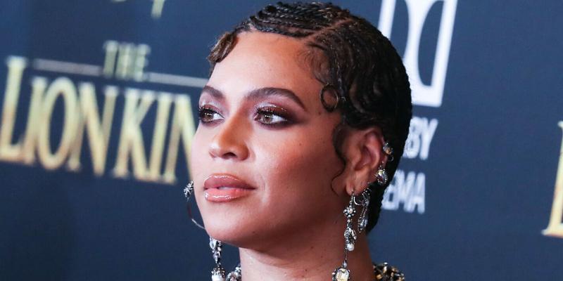 Beyonce Knowles Carter wearing an outfit by Alexander McQueen and Lorraine Schwartz jewelry arrives at the World Premiere Of Disney's 'The Lion King'