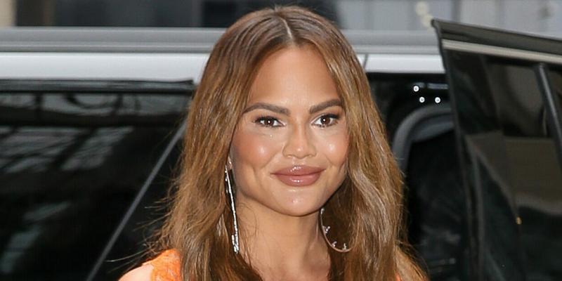 Chrissy Teigen Wears A Mini Dress While Arriving Back At Her Hotel In New York City