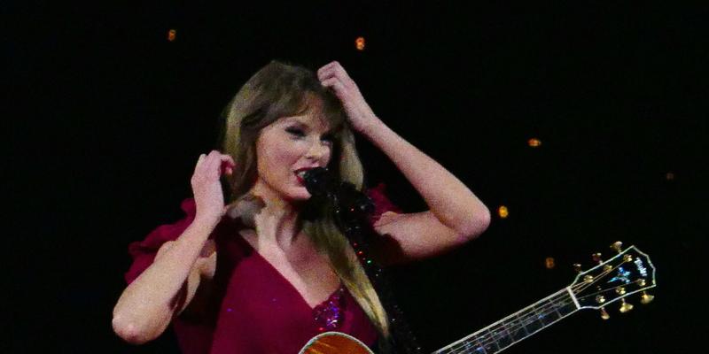 Taylor Swift has to fix her dress sleeve on opening night as her wardrobe falls apart during multimilion dollar tour in Arizona