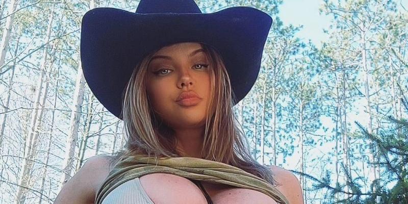 Dana Hamm tugs on her thong in a cowboy hat