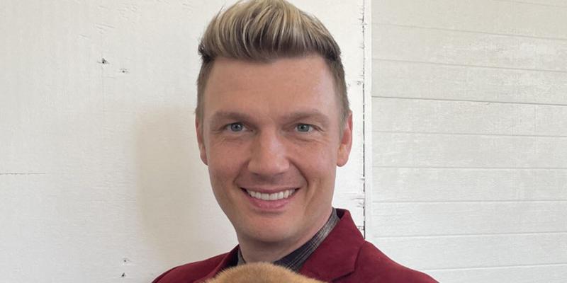 Nick Carter holding a puppy