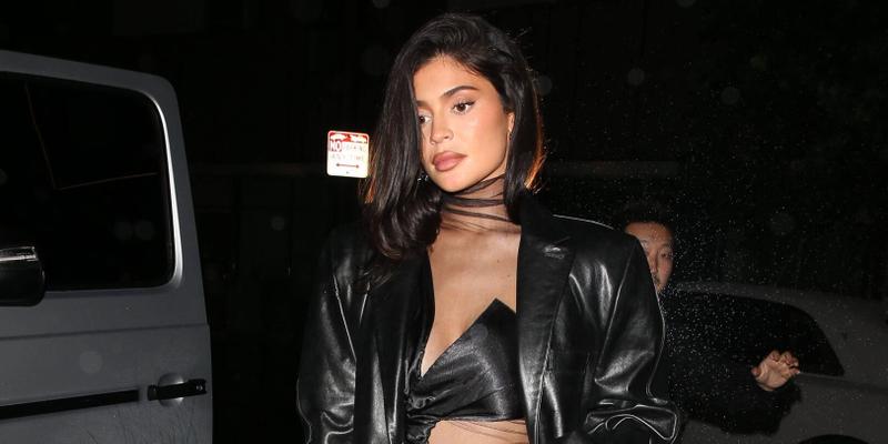 Kylie Jenner steps out in the rain to a friends birthday party at The Nice Guy Bar in West Hollywood CA