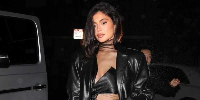 Kylie Jenner steps out in the rain to a friends birthday party at The Nice Guy Bar in West Hollywood CA