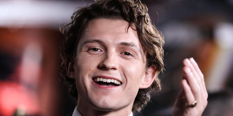 Tom Holland nearly bopped himself waving the chequered flag