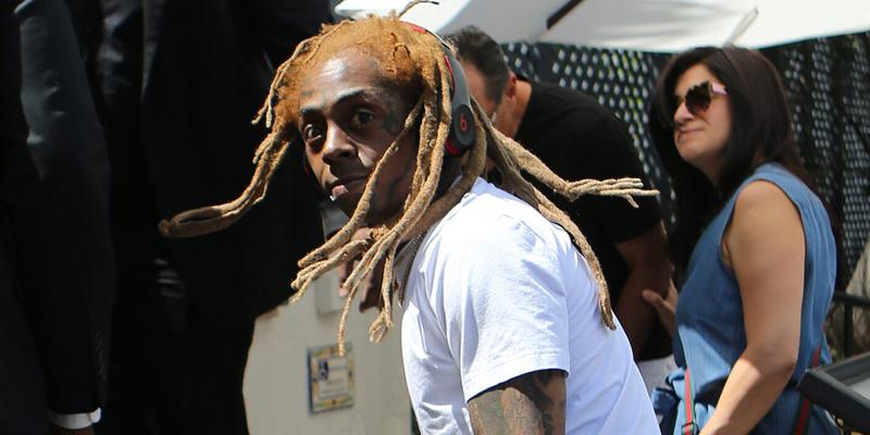 Rapper Lil Wayne sports yellow dreadlocks as he arrives to the wedding of rapper 2 Chainz