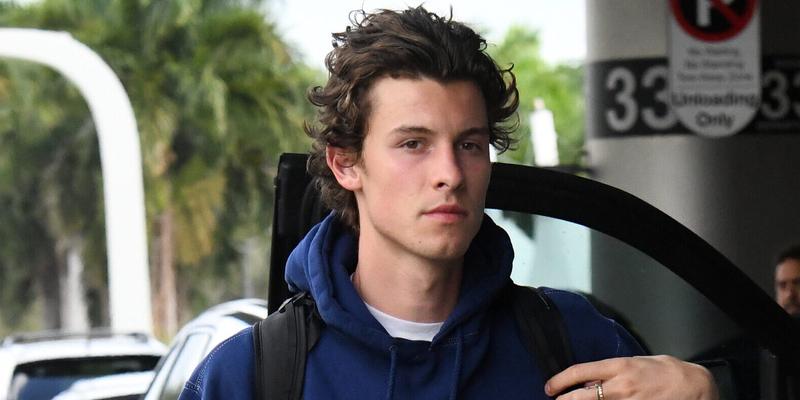 Singer Shawn mendes wraps up his Miami vacation as he is seen wearing a blue hoodie and black jeans at the Miami International Airport