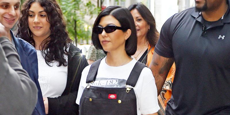 Kourtney Kardashian heads out in a Blink-182 t-shirt and overalls