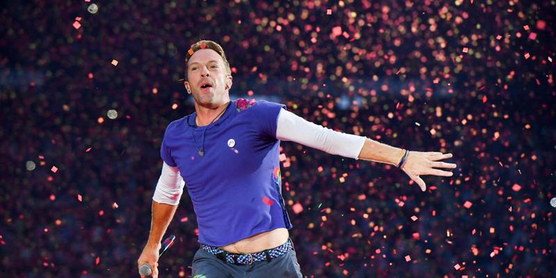 Chris Martin from Coldplay performs at Stade de France