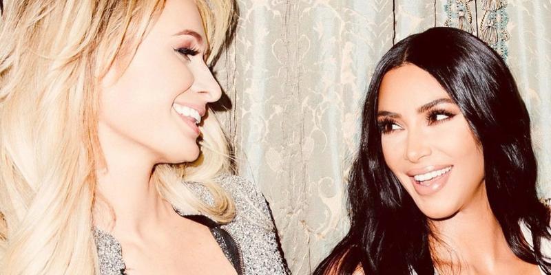 Paris Hilton and Kim Kardashian smiling