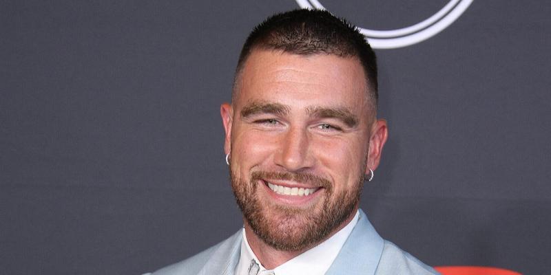 Travis Kelce smiling on the red carpet