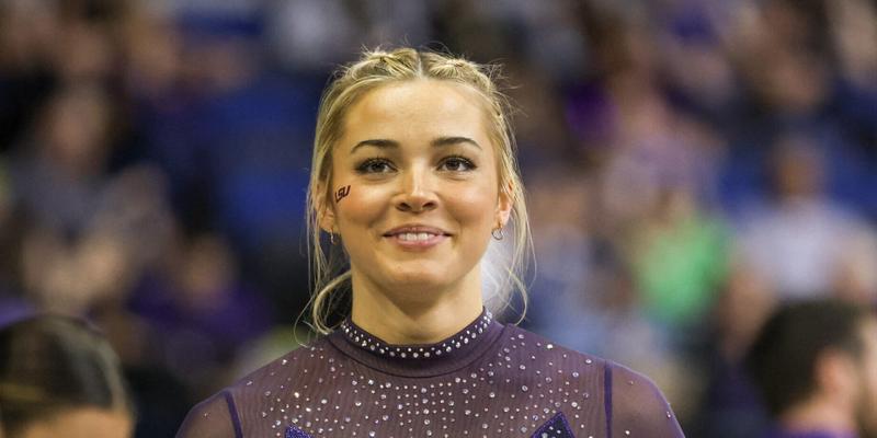 March 8, 2024: LSU's Olivia Dunne smiles to a fan during the Purple and Gold Podium Challenge woman's gymnastics quad meet at the Raising Canes River Center in Baton Rouge, LA. Jonathan Mailhes/CSM (Credit Image: © Jonathan Mailhes/Cal Sport Media) Newscom/(Mega Agency TagID: csmphotothree239106.jpg) [Photo via Mega Agency]