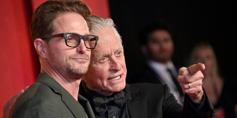 Michael Douglas and son Cameron pose on red carpet.