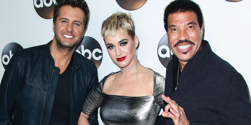 Luke Bryan, Katy Perry, and Lionel Richie pose on red carpet