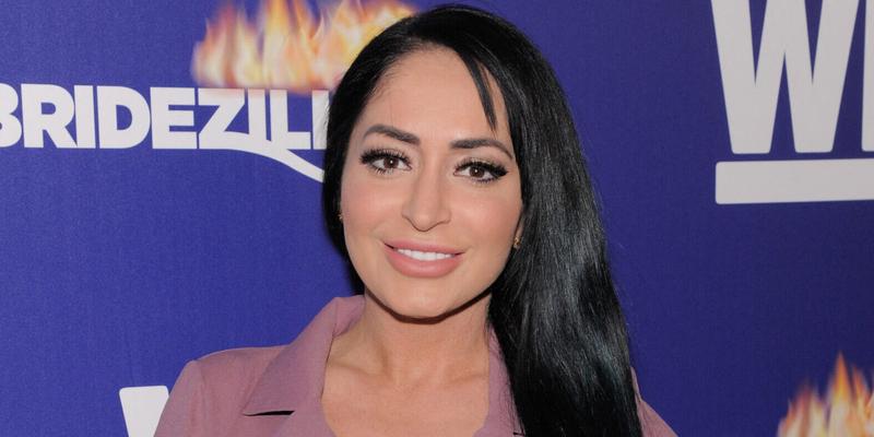 Angelina Pivarnick poses on the red carpet at WEtv's Premiere Fashion Event Celebrating the Return of Bridezillas